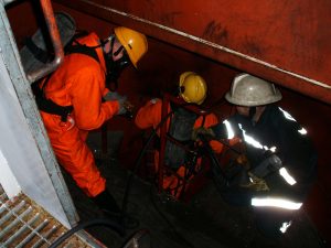group of people working in a confined space